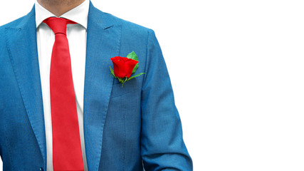 Romantic businessman in blue suit, red tie, white shirt with red rose in pocket isolated on white background. Copy space. Real gentleman dress code. Greeting for woman's day, 8 March, 14 February