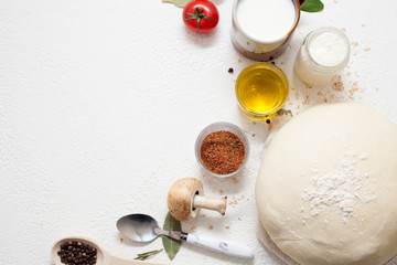 White background decorated with ingredients and appliances for cooking, baking. Concept of cooking or making food.
