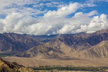forest and village in a mountain desert valley