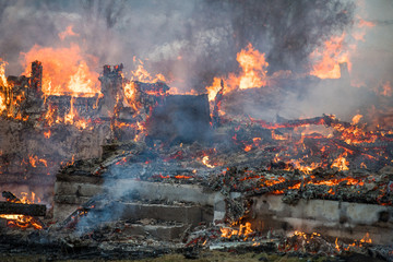 Norwegian firefighter trying to put out flames house on fire