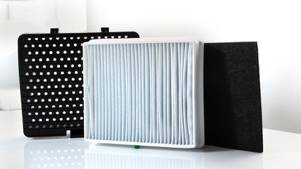New white square dust filter for vacuum cleaner.