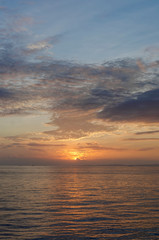The sun rises at Dawn over an inshore Peruvian Oil Field off the North West Coast of the Country near to Talara.