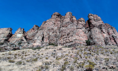 The amazing badlands and palisades of the John Day Fossil Beds clarno unit and rock formations in a semi desert landscape in Oregon State