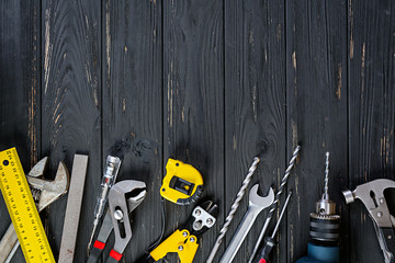 Set of working tools on wooden rustic background. Top view. Copy space