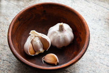 Peeled Garlic close-up shot on vintage background