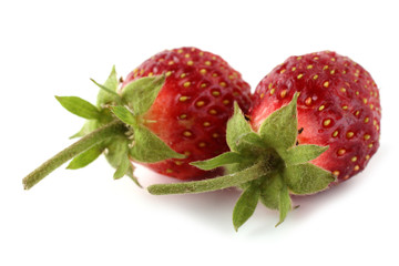Two strawberries isolated on white