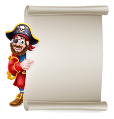 A pirate captain cartoon character peeking around a scroll sign background and pointing at it