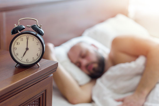 Focus On The Alarm Clock, Man Wakes Up Early In The Morning, Healthy Sleep Concept, Noisy Effect For The Atmosphere