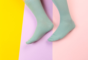 legs in colorful socks on colorful  background - Image