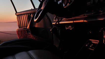 sunset reflecting off interior of old porsche