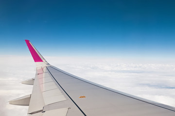 Fototapeta premium View from airplane window with blue sky