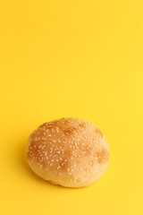 delicious bread rolls on colored background