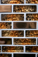 Decorative rust or orange glass bricks on the wall as background