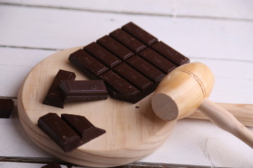 melting chocolate tablet in color background