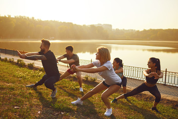 Group of young people at a training session in a park