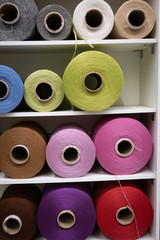 Cotton sewing threaded reels in a sewing shop