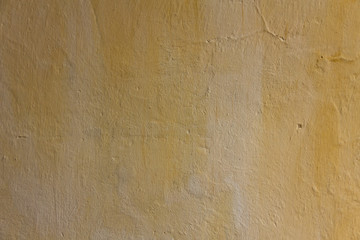 Wall of the house in drips. The texture of the plaster is clearly visible. Copy space