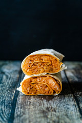 Healthy Vegan / Vegetarian Tortilla Wrap with Rice Pilaf on Wooden Surface.