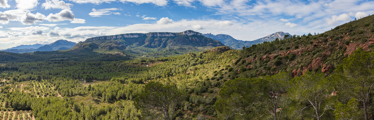Naklejka premium Great panorama of the mountains of the Natural Reserve of Lleberia from the Sanctuary of the Mare de Deu of Roca, Mont-roig, Catalonia, Spain