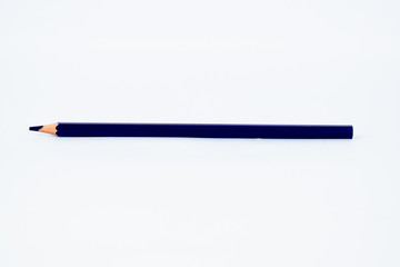 Deep blue colored sharp wood pencil crayon isolated on a white background