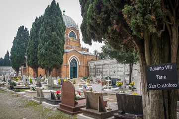 Inside the cemetery of Venice, with small church. Italy, Europe.