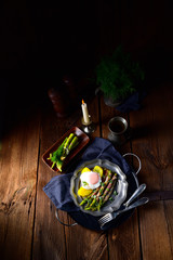 delicious green asparagus wrapped in bacon and egg