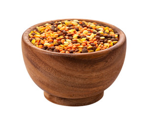 Lentils mix in wooden bowl isolated on white background