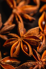 Dried anise stars on the rustic background. Selective focus. Shallow depth of field.