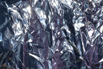 Silver crumpled foil background