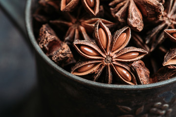 Obraz na płótnie Canvas Dried anise stars on the rustic background. Selective focus. Shallow depth of field.
