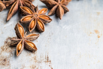 Dried anise stars on the rustic background. Selective focus. Shallow depth of field.