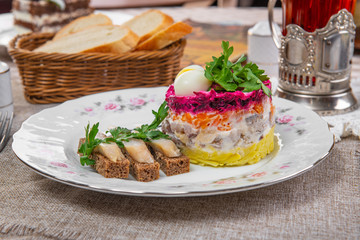 puff salad with fish sandwich in a brown cage