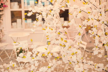 home interior decoration: the branches in vintage bottles and baskets on white shelves