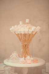 home interior decoration: the branches in vintage bottles and baskets on white shelves