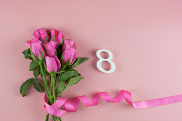 Fototapeta na wymiar Pink Rose flower and 8th Number on pink background with copy space for text. Love, Equal and International Women day concept