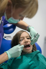 Young Smiling Boy Posing Before Regular Dental Check Up in Clinic