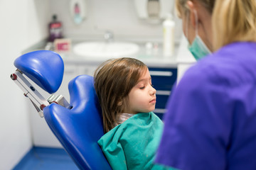 Young Smiling Boy Posing Before Regular Dental Check Up in Clinic