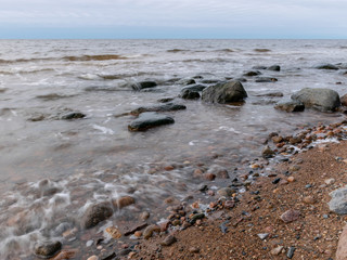 Fototapeta na wymiar landscape with a rocky beach in the evening