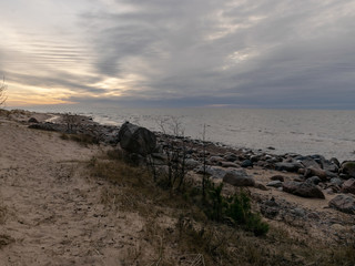 Fototapeta na wymiar landscape with a rocky beach in the evening