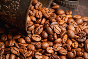 Coffee beans on the rustic wooden background. Selective focus. Shallow depth of field.