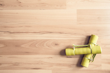 Gym at home. Dumbbells with wooden background