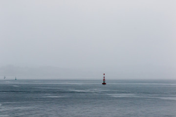 Fototapeta premium Isolated Bouy at the port entrance