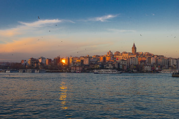 Naklejka premium Bosphorus in winter on sunset with seagulls over the water