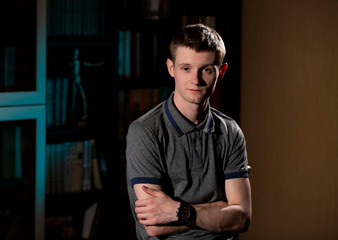 Portrait of a young man in the interior.