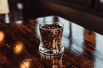 Coffee seed in glass on the table.