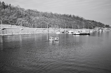 A vintage boat is sailing on the Vltava river (Prague, Czech Republic, Europe)