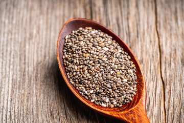 Chia seeds on the wooden table. Selective focus. shallow depth of field.