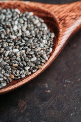 Chia seeds on the wooden table. Selective focus. shallow depth of field.