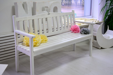 Wooden white sofa in a bright children's room in the house