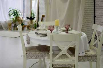 Photo of white chairs and table in a stylish bright room at home